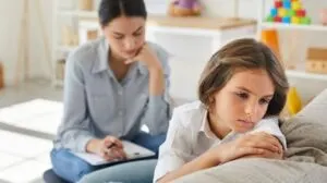 unhappy child at therapist's office
